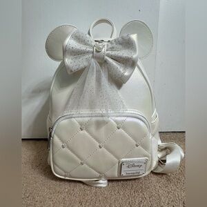 Loungefly Cream Iridescent Quilted Backpack with 2 Bows. Used only 1 time